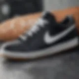 Close-up of black Nike shoes with white soles highlighting the design