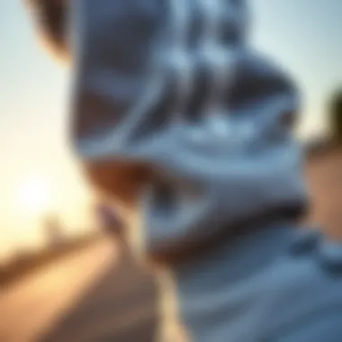 Close-up of cuffed hem on Adidas joggers