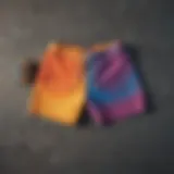 A vibrant pair of color shorts laid out on a skateboard