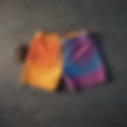 A vibrant pair of color shorts laid out on a skateboard