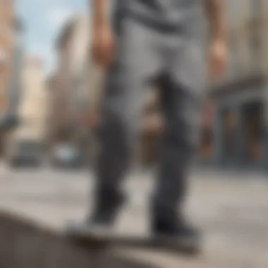 Skateboarder wearing gray cargo pants in an urban setting