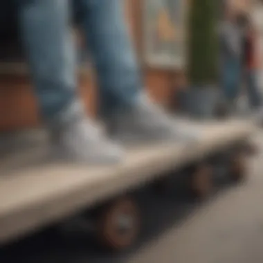 A group of skateboarders hanging out, all wearing different styles of grey low top Vans.