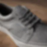 A close-up view of grey low top Vans showcasing their unique design and texture.