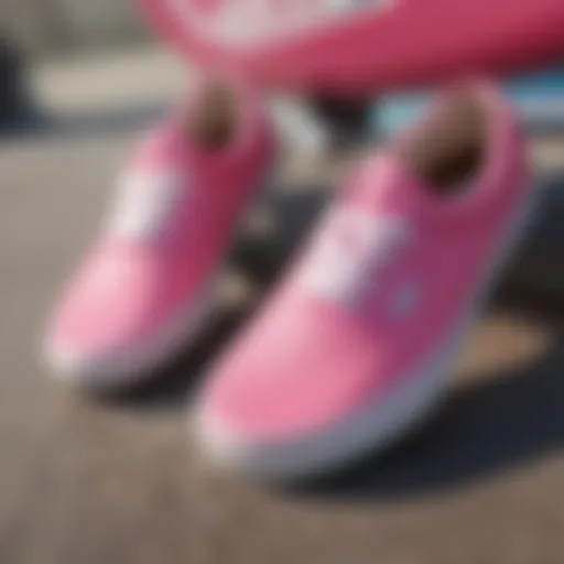 A close-up of vibrant pink Vans shoes on a skateboard deck