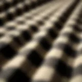 A close-up of black and white check flannel fabric showcasing its texture and pattern.