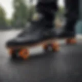 Close-up view of adidas black skate shoes on a skateboard