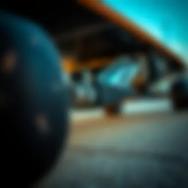 Close-up of the truck and wheel assembly of a drop through longboard