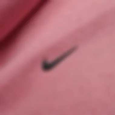 Close-up of the fabric texture of the pink Nike hoodie, highlighting material quality