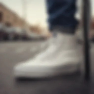 Close-up of white vans footwear with skateboarding gear