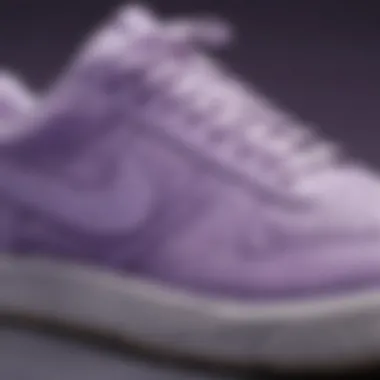 Intricate Design Elements of Nike Lilac Sneakers Close-up view of Nike lilac sneakers showcasing intricate design details.