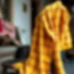 Vibrant yellow flannel shirt draped over a rustic chair