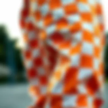 Close-up view of orange and white checkered fabric texture
