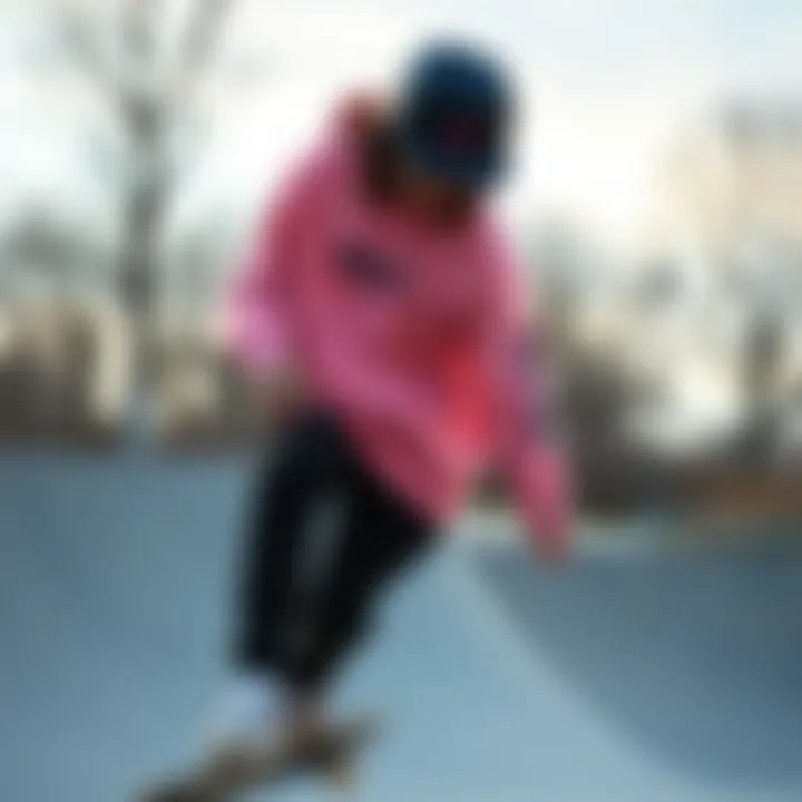 Skateboarder wearing pink Nike sweatshirt at skate park