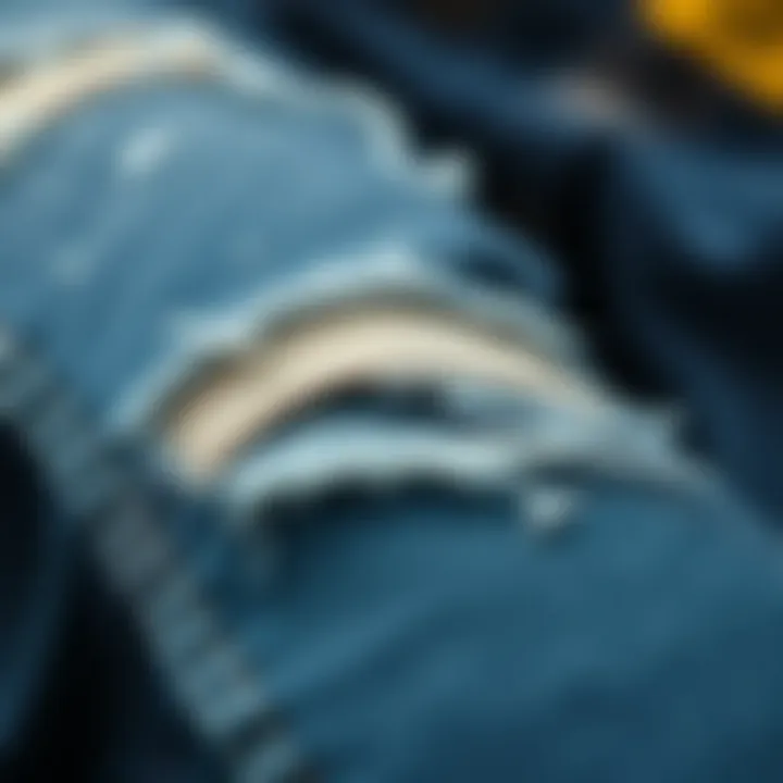 Close-up of Stylish Rips on Denim A close-up of denim fabric with stylish rips and tears