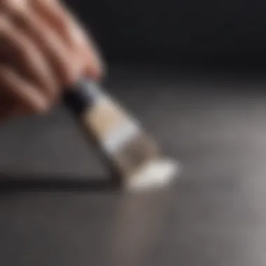 Demonstration of cleaning grip tape with a brush