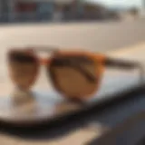 Stylish Spy Cyrus sunglasses resting on a skate deck