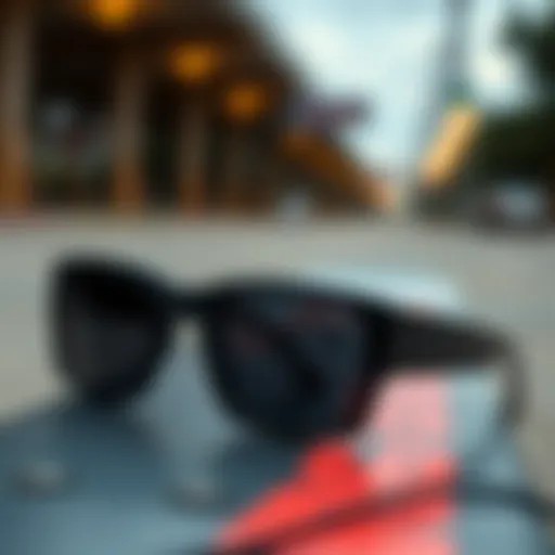 Stylish black square sunglasses on a skateboard deck