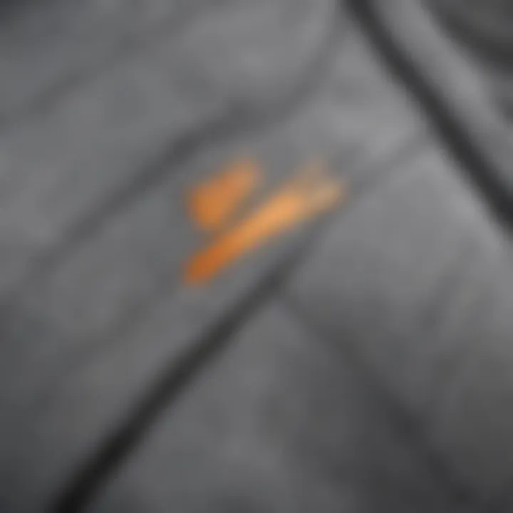 Close-up of the fabric texture and stitching of the grey Nike jacket