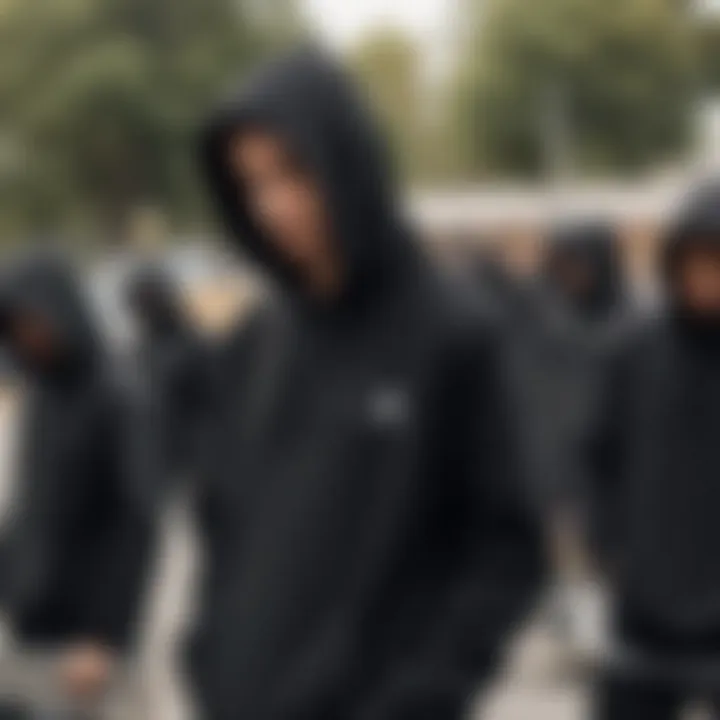 A group of skaters in black hoodies at a skate park