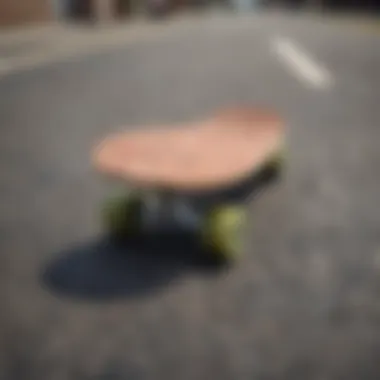 A close-up of a penny skateboard on urban pavement