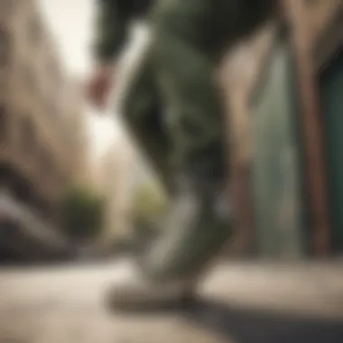 Skateboarder wearing army green Converse low tops in action