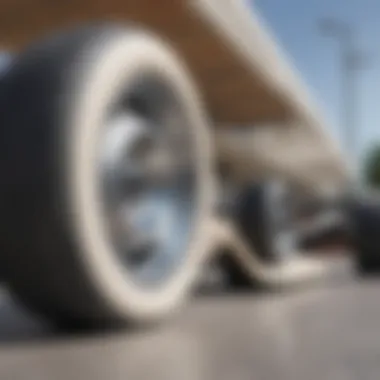 Close-up of white skateboard wheels and deck detailing.